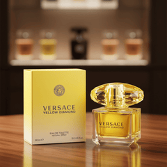 Versace Yellow Diamond perfume bottle and packaging on a wooden surface with blurred shelves in the background.